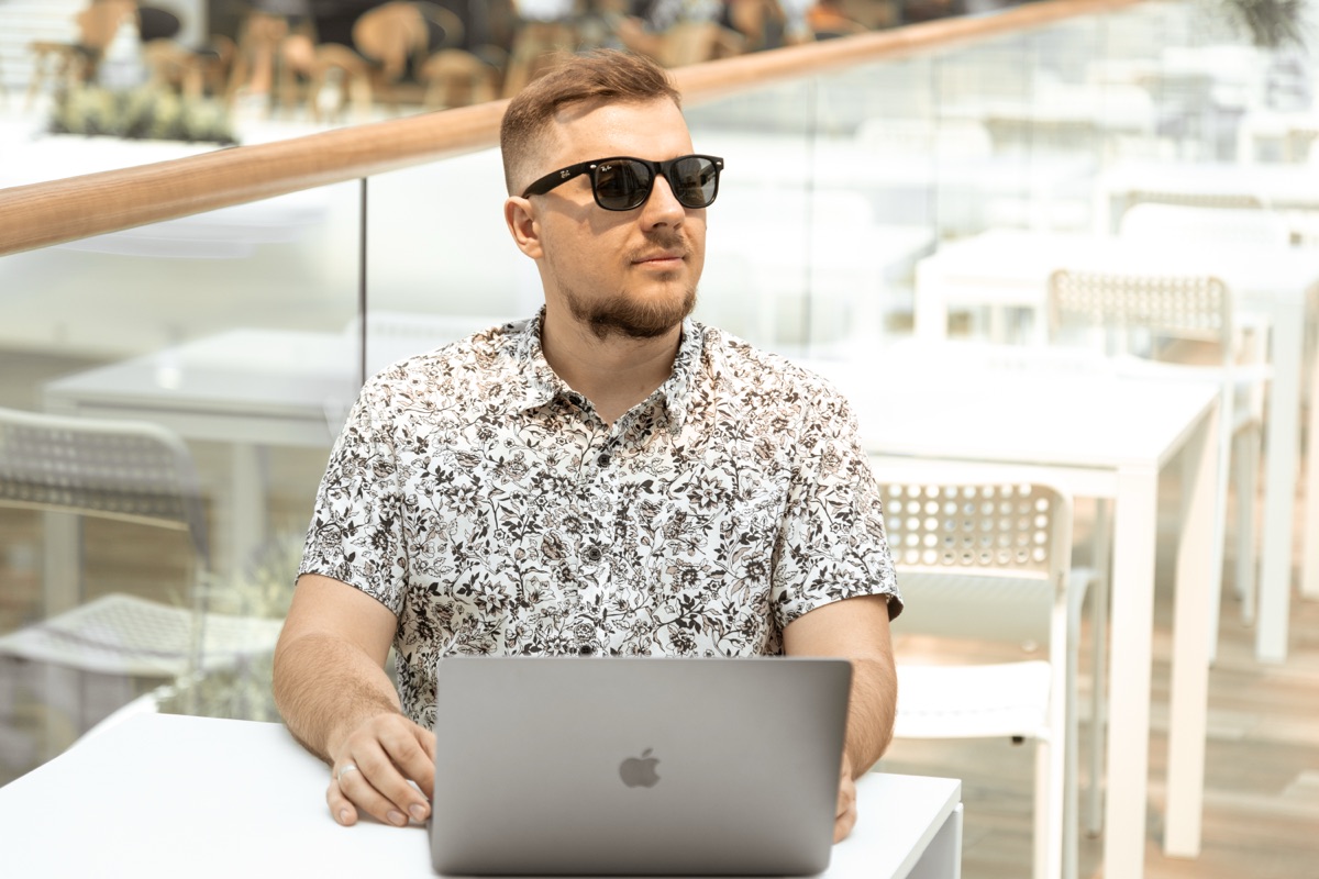 Ivan with sunglasses at laptop